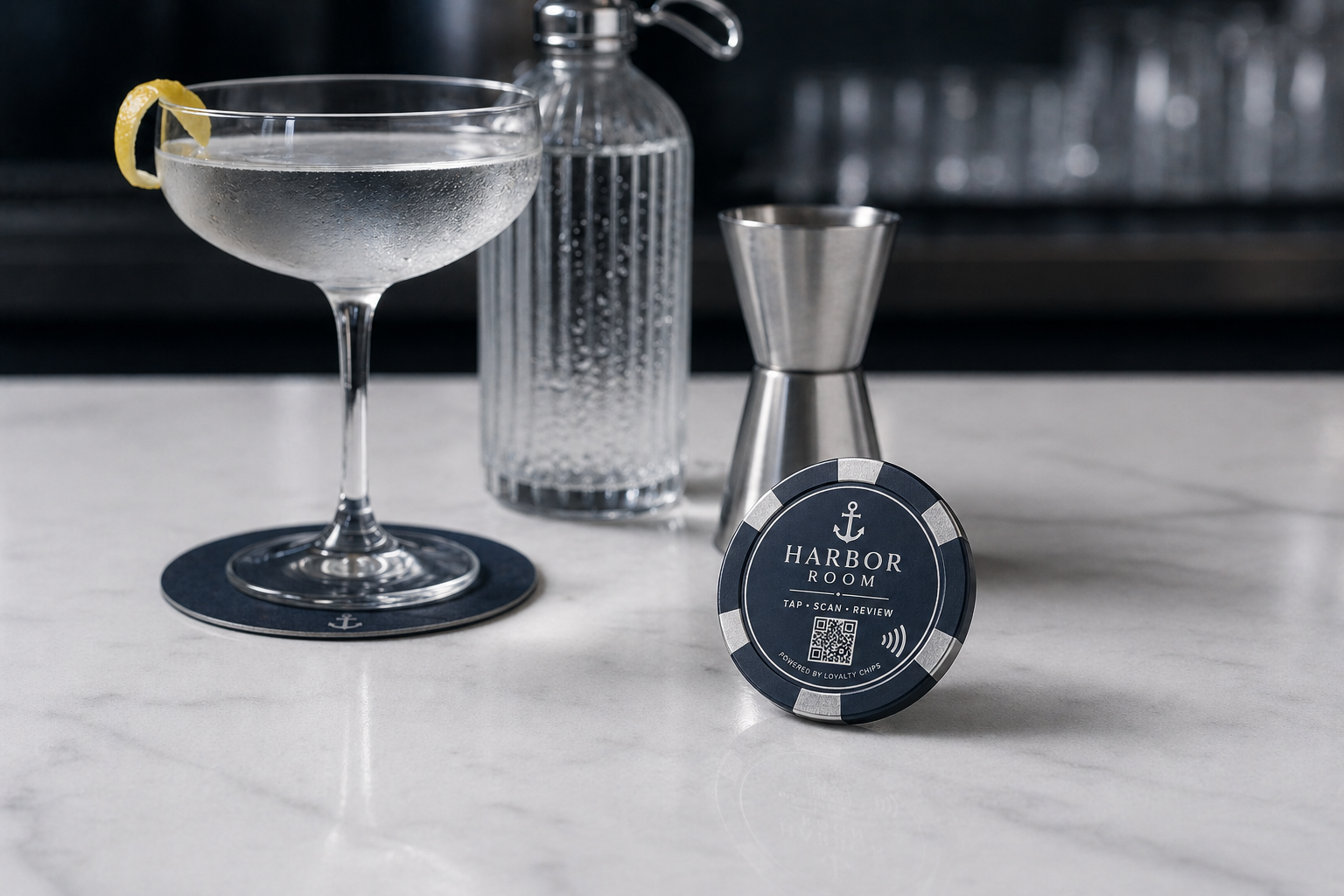 Harbor Room navy and silver poker chip on a white stone bar top.